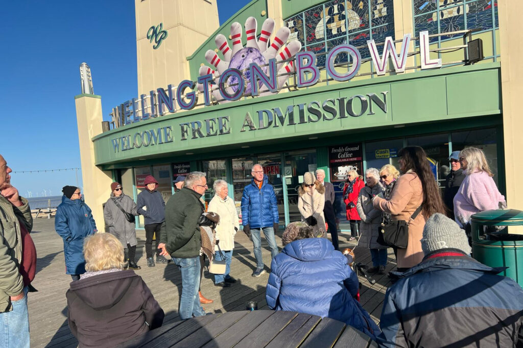 Tour guests outside the Wellington Pier as part of our Seafront Tour