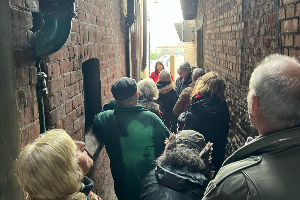 Tour guests in Old Hannah's Row as part of our Great Yarmouth Heritage Tour.